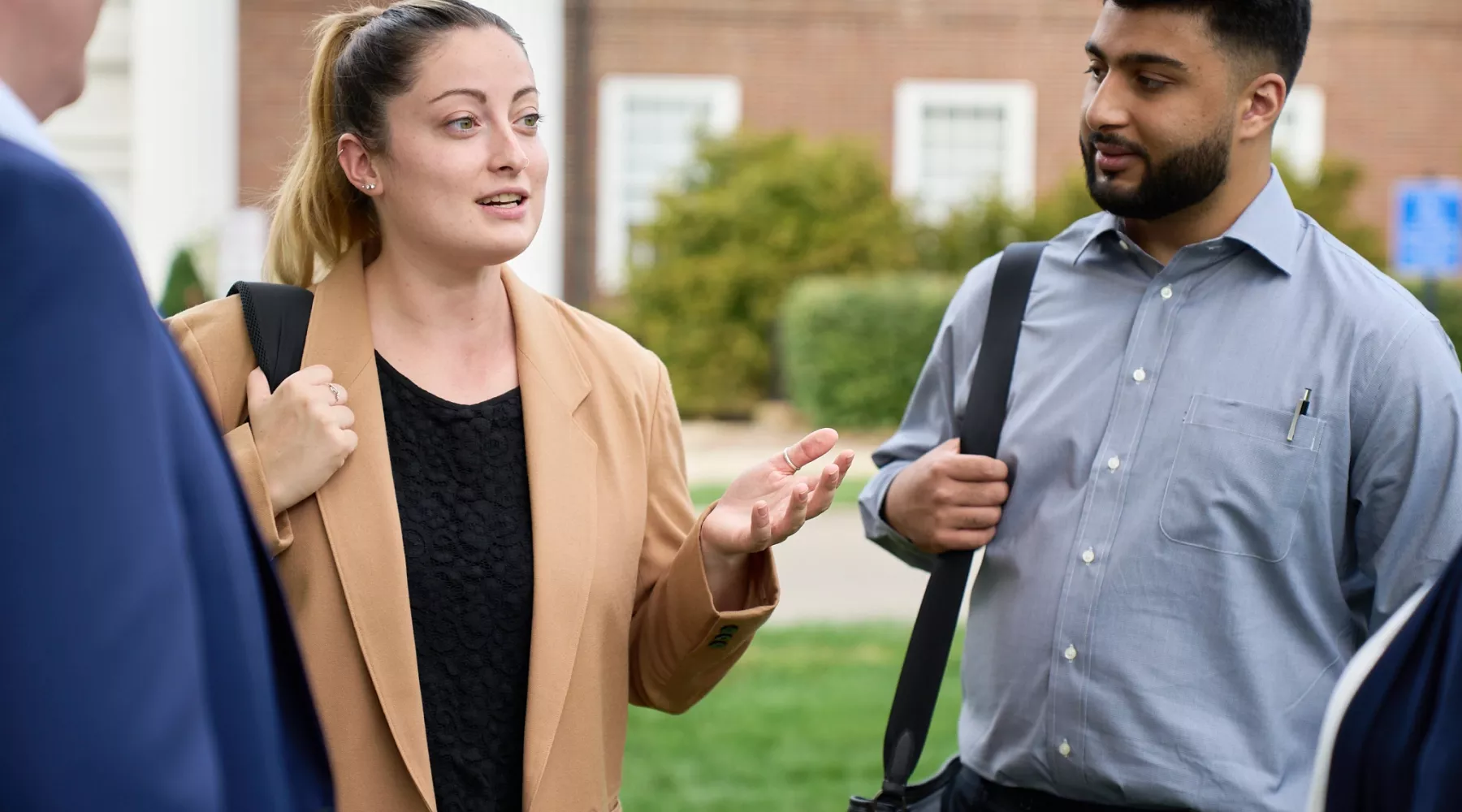 Law students talking in the courtyard of the Brandeis School of Law.