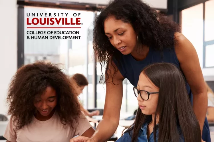 Image of female teacher helping two students who are learning on their electronic learning devices