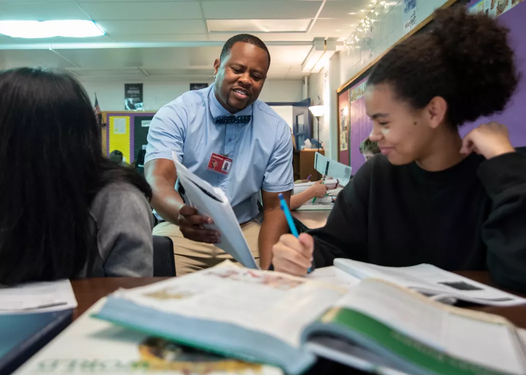 Education student working with middleschool students in the community