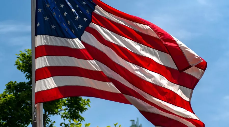 American flag waving in the wind on Belknap Campus