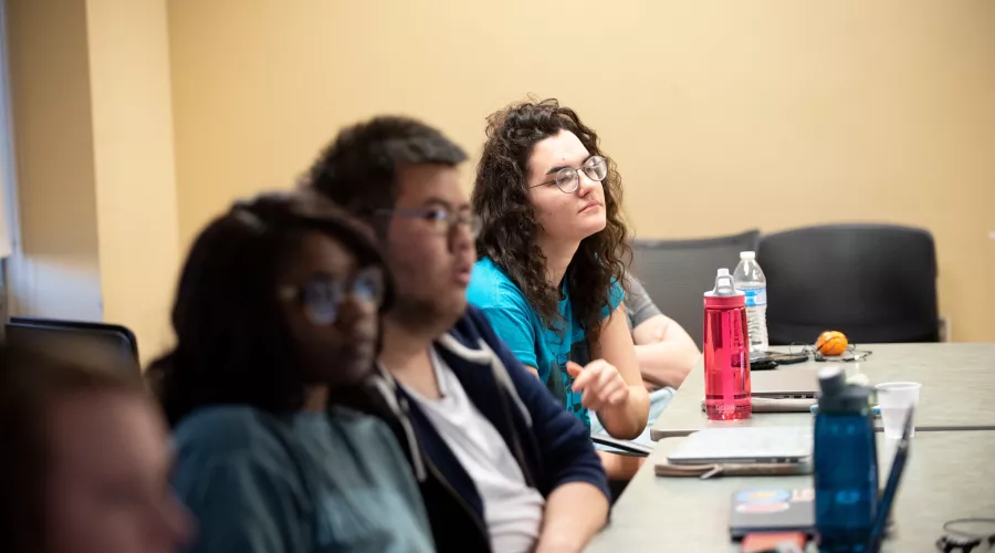Students listen to their professor during Music History