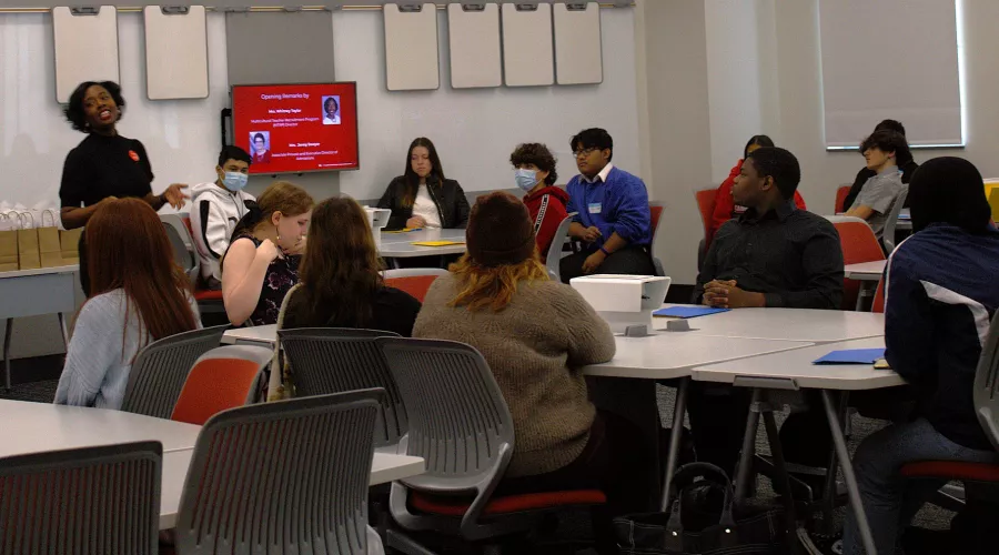 Director of MTRP, Whitney Taylor, presenting to a group of secondary education level students
